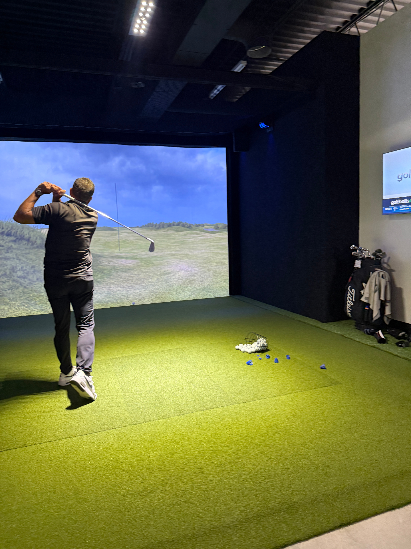 Member practicing in a private simulator bay